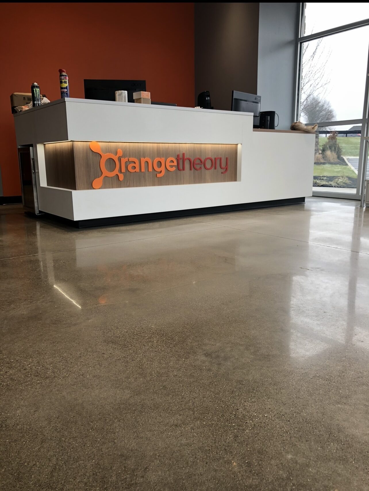 Polished floor at an Orangetheory Fitness front desk