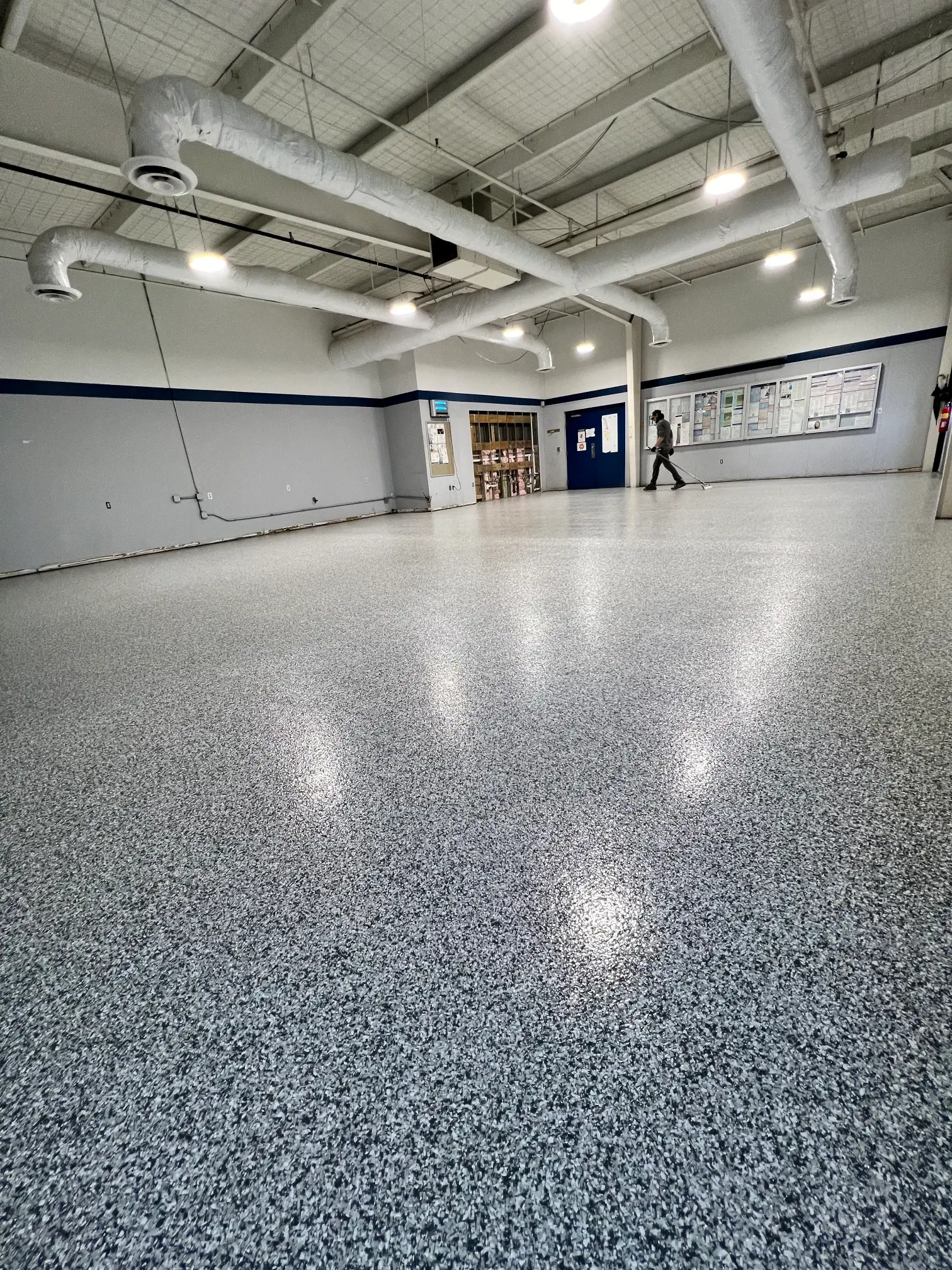 Speckled epoxy floor in a Packaging Corporation of America facility