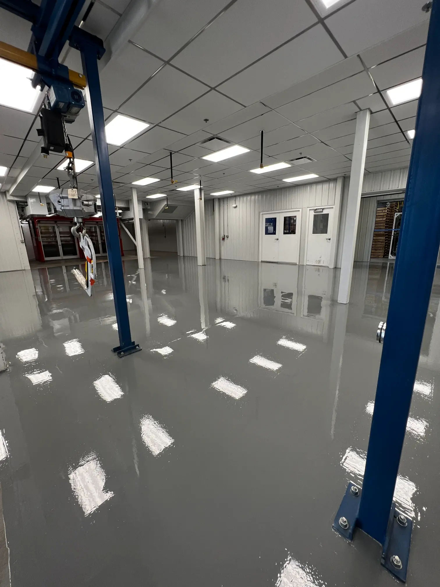 High-gloss grey epoxy floor in a Superior Essex plant