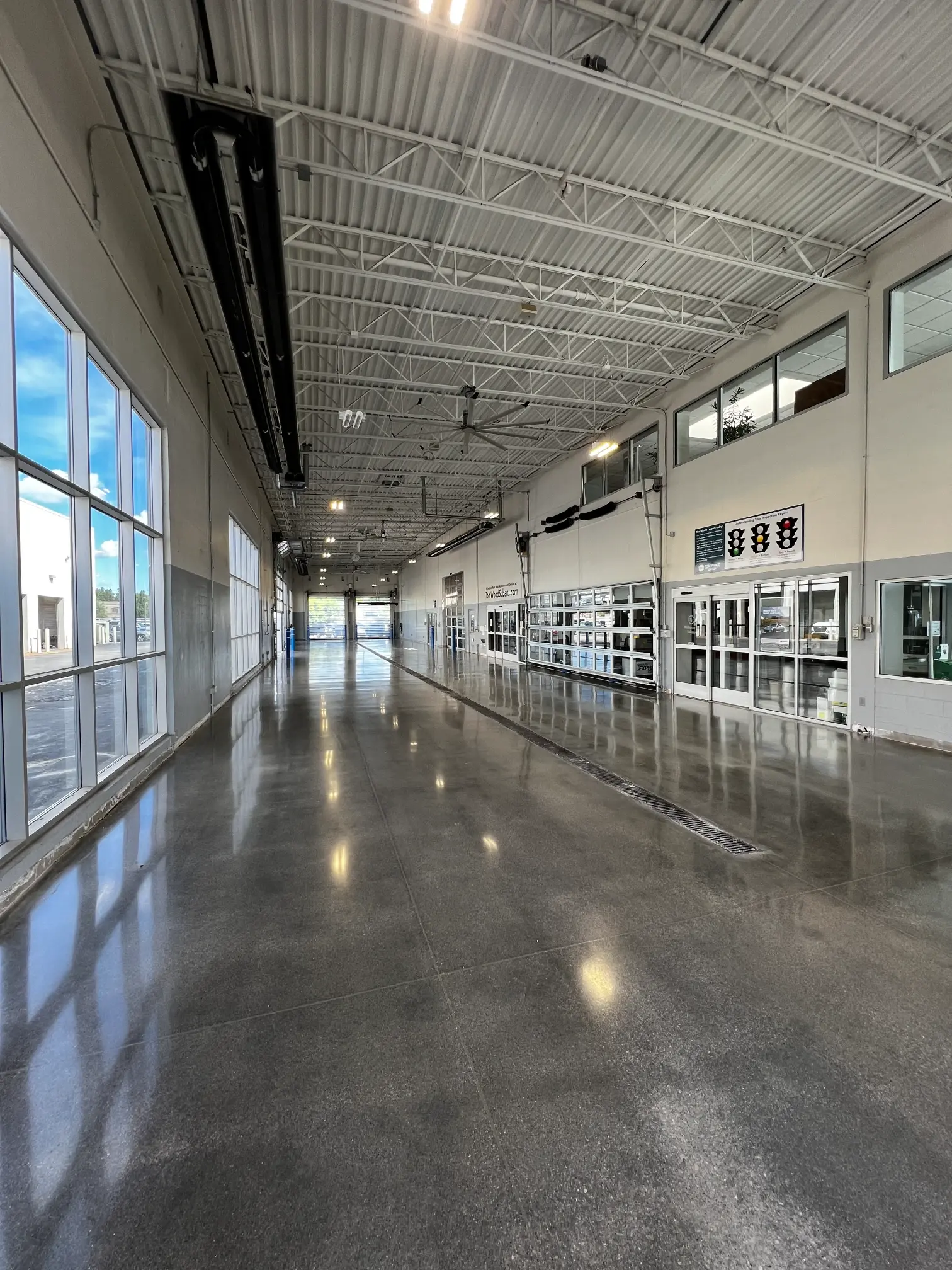 Polished concrete floor along a window wall at Tom Wood Ford