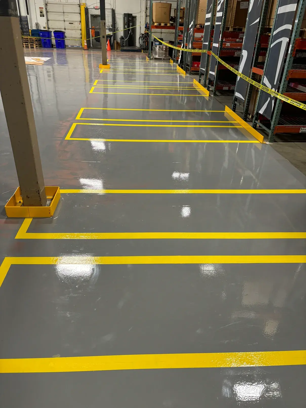 Grey epoxy floor with yellow safety striping at Toyota Material Handling
