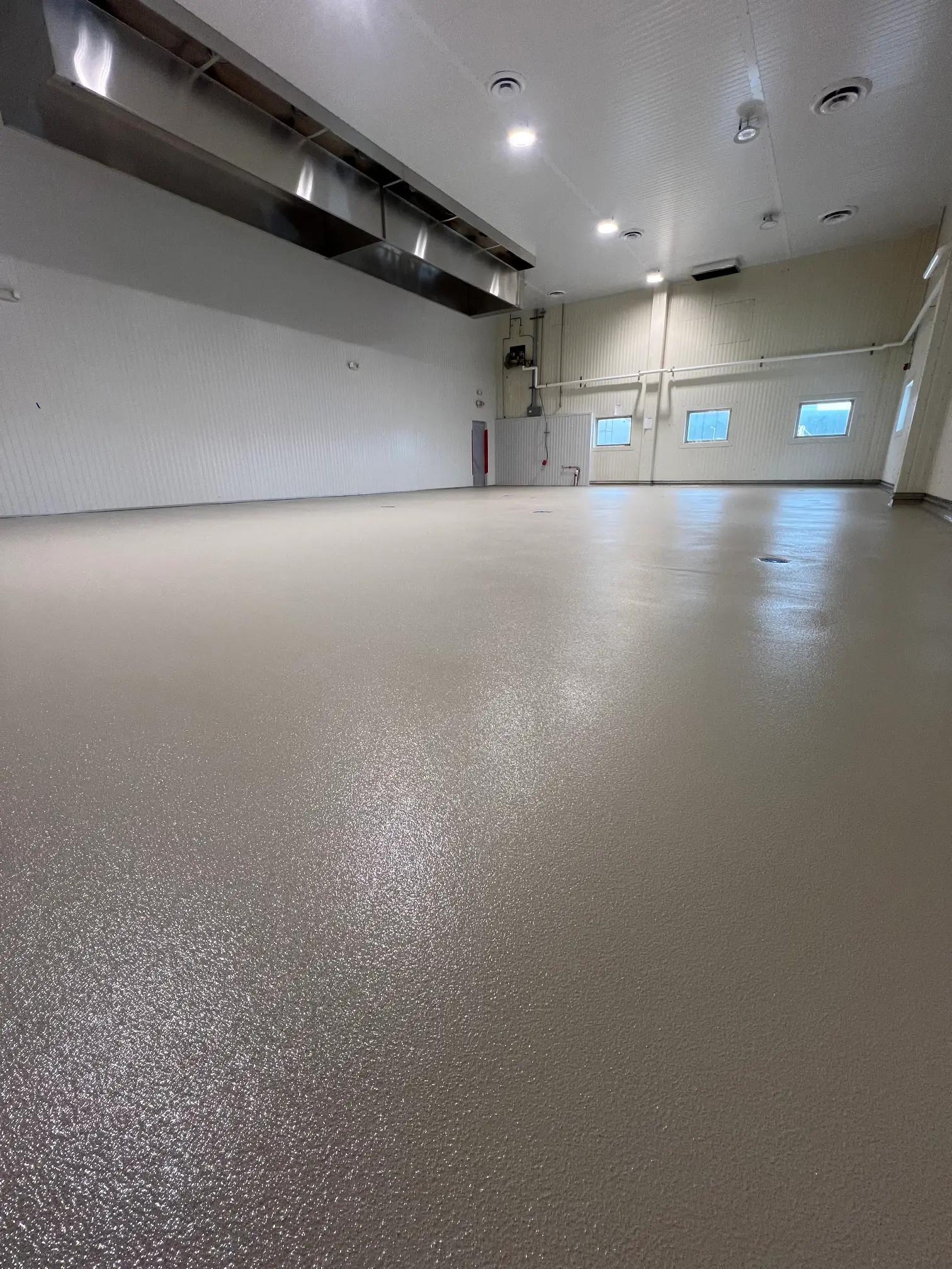 Seamless light epoxy floor at Weaver Popcorn